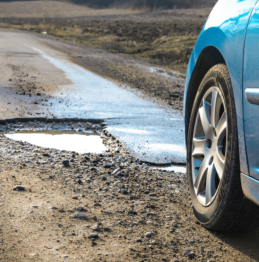 car driver avoid potholes in south africa