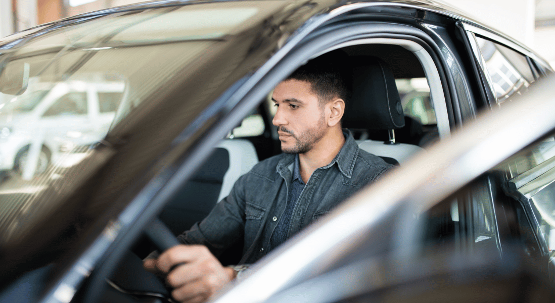 man doing inspection before buying a second hand car
